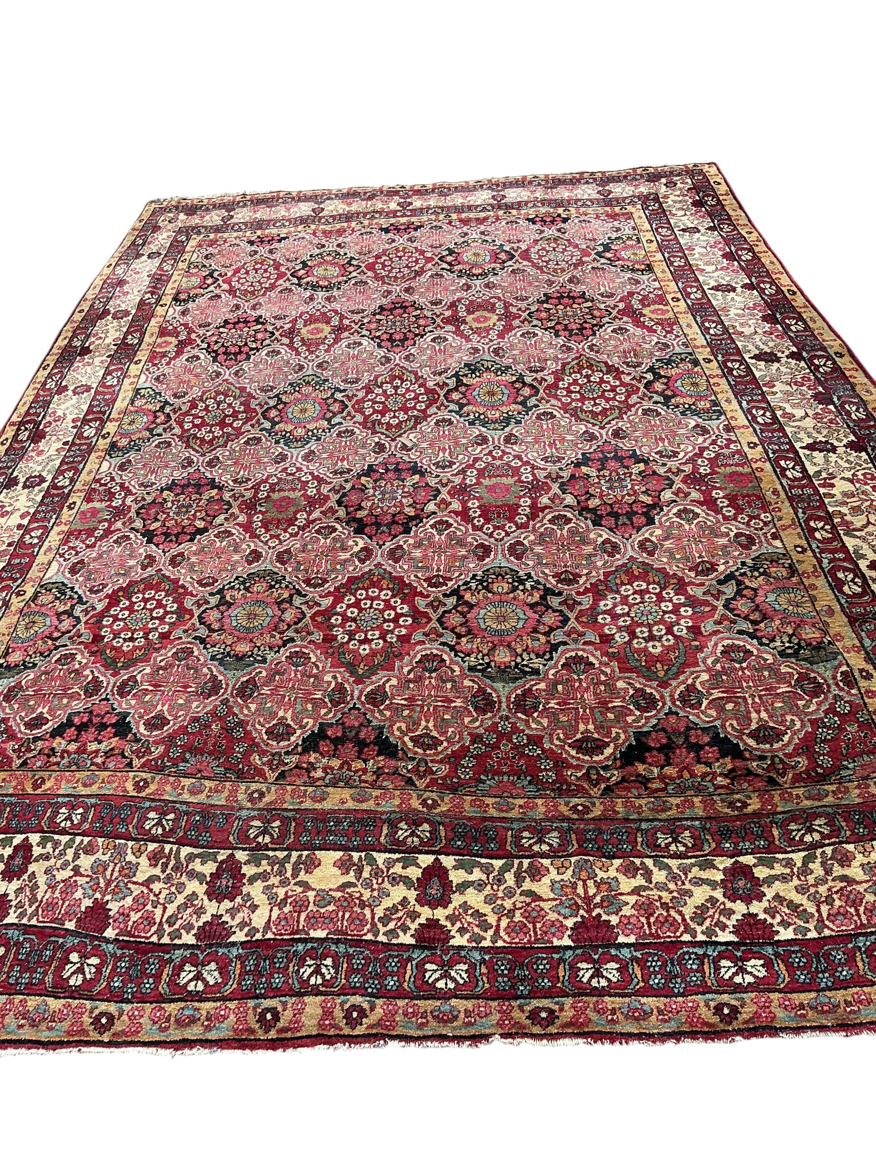 An Agra multi coloured carpet, the ground woven with interlocking oval medallions, 455 x 315cm
